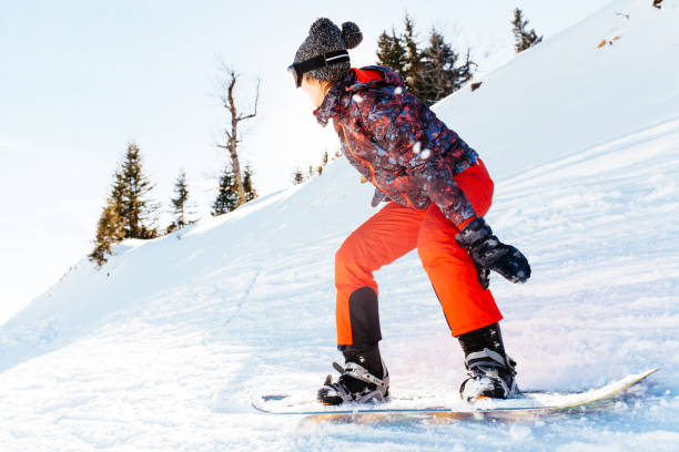 istock female snowboarder having fun on ski track 922076546