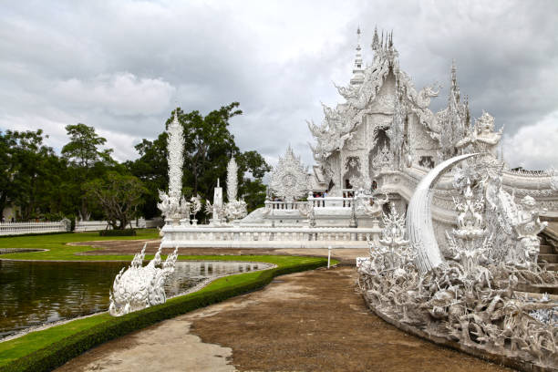 Chiang Rai, Thailand - August 04 2012: Wat Rong Khun, perhaps better known to foreigners as the White Temple, is a contemporary, unconventional Buddhist temple in Chiang Rai Province, Thailand.