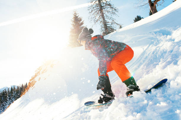 istock female snowboarder having fun on ski track 922076638