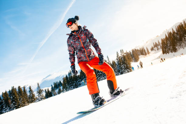 istock female snowboarder having fun on ski track 922076654