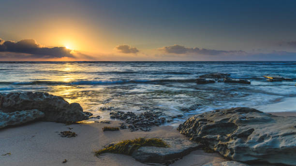 istock Sunrise Seascape with Rocks 922077336