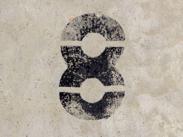 istock Number eight 8 black painted on old rugged light grey concrete wall background 922077374
