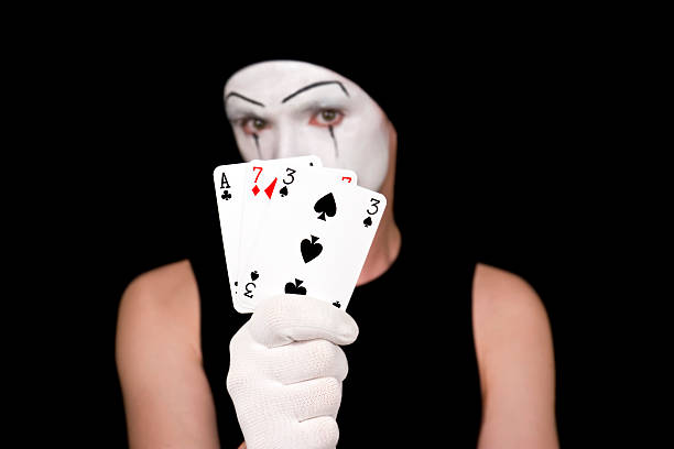 istock mime with playing cards on black background 92208509