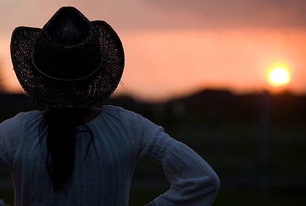 istock Cowgirl Silhouette at Sunset 92208570