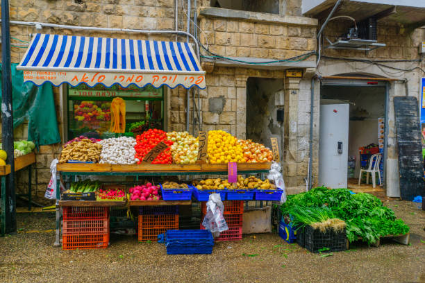 Haifa, Israel - February 17, 2018:  Scene of Wadi Nisnas market, with various vegetables on sale, in Haifa, Israel