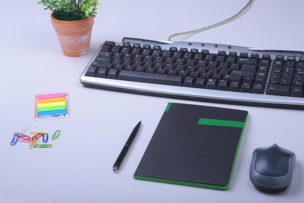 istock White office desk table with laptop, smartphone, notebook, plan, and glasses. Top view with copy space, 922091610