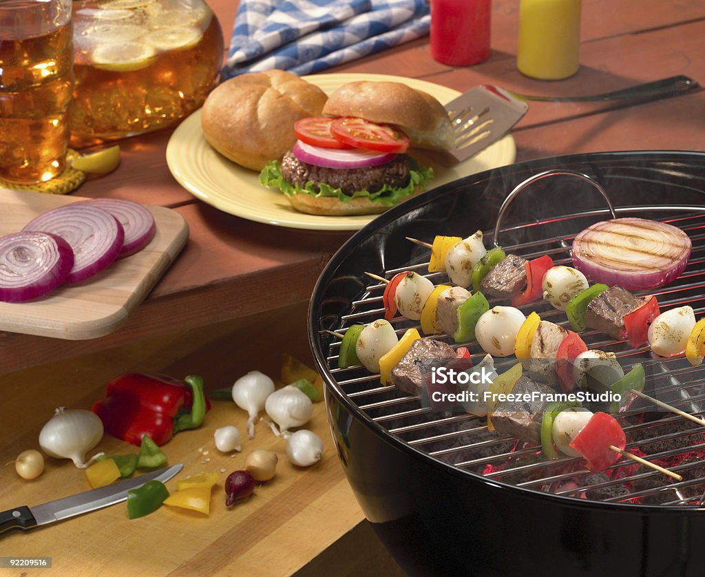 Summer backyard BBQ with burgers & kabobs  Barbecue Grill Stock Photo