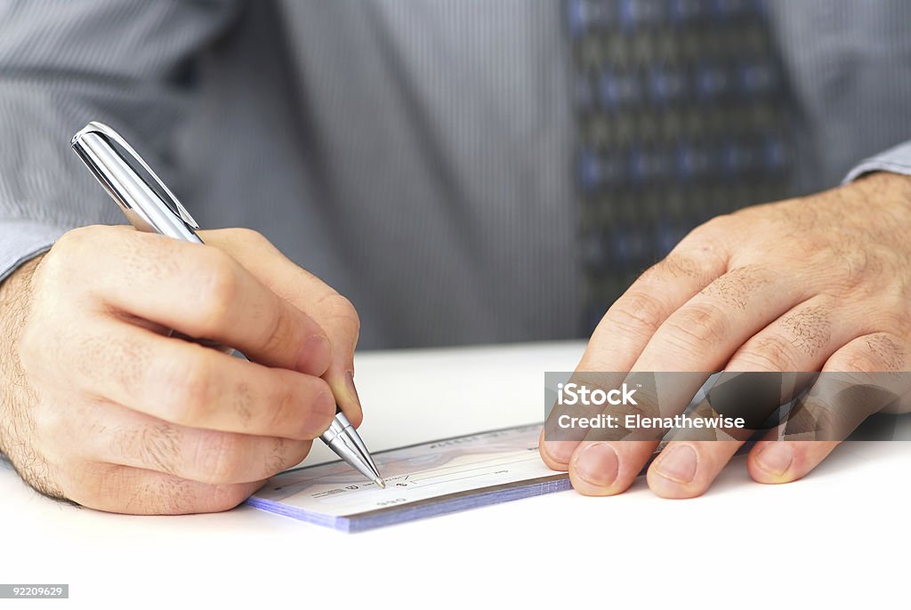 Writing a check  Adult Stock Photo