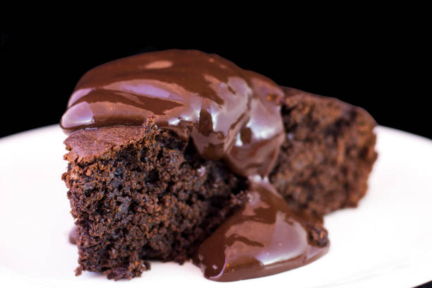 istock Sliced delicious brownie with hot chocolate melting sauce on it. 922107030
