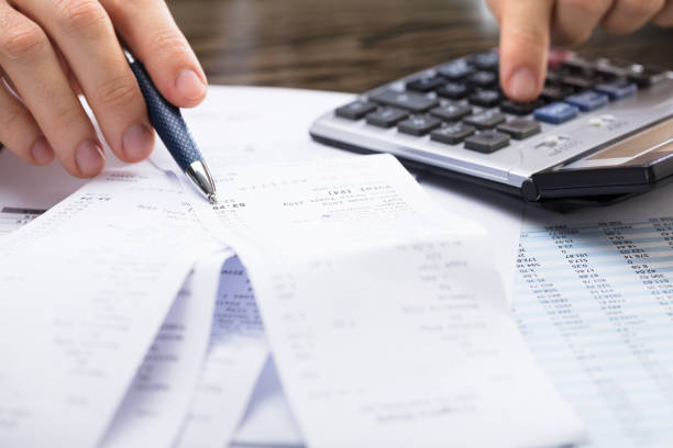 istock Businessperson Calculating Receipt 922109412