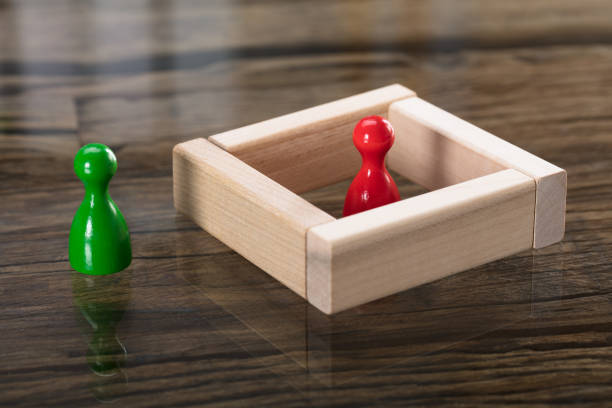 istock Green And Red Figurine Pawn On Desk 922109820