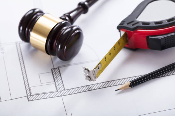 istock Gavel And Measuring Instrument On Blueprint 922112050