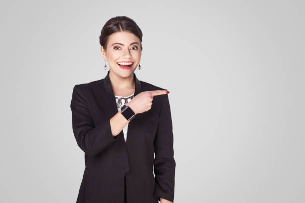 istock Happiness businesswoman pointing finger at copy space 922112872