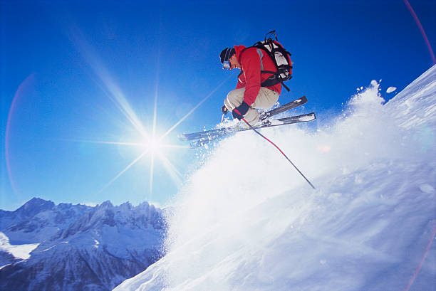 Young man skiing Young man skiing on mountains extreme skiing stock pictures, royalty-free photos & images