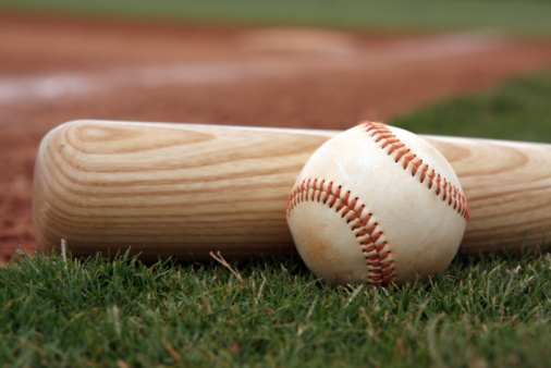 Baseball and bat near first base