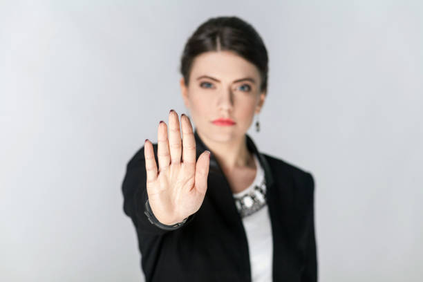 istock Focus on hand. Seriously woman showing stop hand sign 922117406