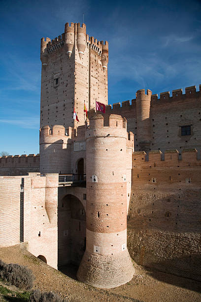 Mota castle tower in Medina del Campo Valladolid Spain landmark monument public castle quarterdeck tower fortress architecture from year 1.300 in travel destination La Mota in Medina del Campo city Valladolid Castile Spain Europe blue sky valladolid mexico photos stock pictures, royalty-free photos & images