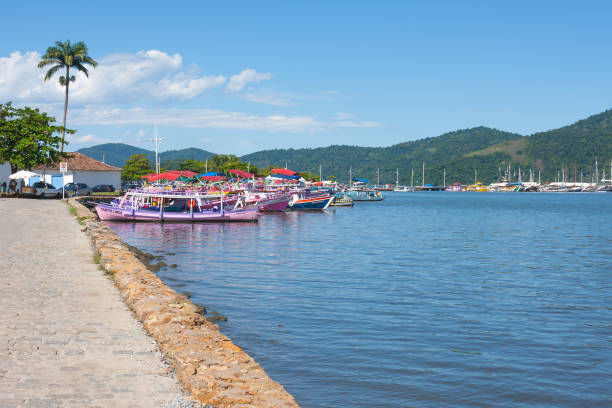 Paraty harbour Colourful boats in Paraty Harbour paraty brazil stock pictures, royalty-free photos & images