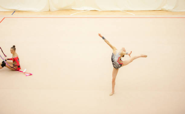 istock Teenage Rhythmic Gymnastics Athletes Practicing 922129596