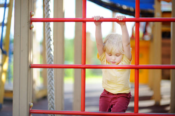 istock Little boy having fun on outdoor playground 922129716