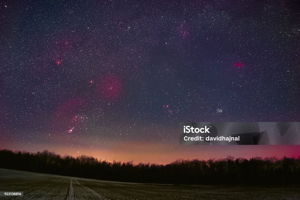 Winter Night Sky Winter night sky including Barnard’s Loop, the Orion Nebula, the Flame Nebula, the Rosette Nebula, the California Nebula, and the Pleiades as seen from Battenberg in the Palatinate Forest in Germany. Winter Stock Photo