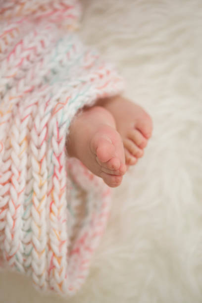 istock baby feet in blanket, copy space. selected focus 922141330