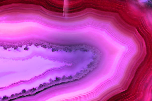 istock Abstract background, pink agate slice mineral with parallel and curved lines 922141392
