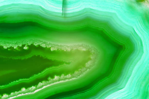 istock Blue and green agate slice mineral with parallel and curved lines, abstract background 922146240