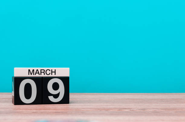 istock March 9th. Day 9 of march month, calendar on turquoise background. Spring time, empty space for text, mockup 922149036