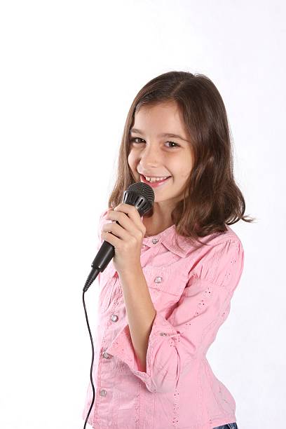 istock Young Girl / Child Singing In Microphone 92215108