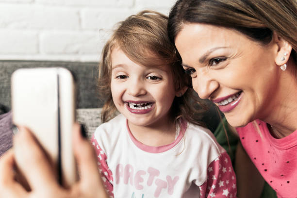 istock Mother and little daughter make some selfies 922153718
