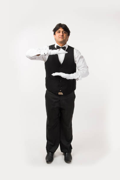 istock Asian Indian waiter or Bartender isolated over white background, selective focus 922153840
