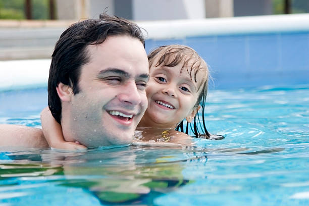 istock Father and daughter in the swimming pool 92215579