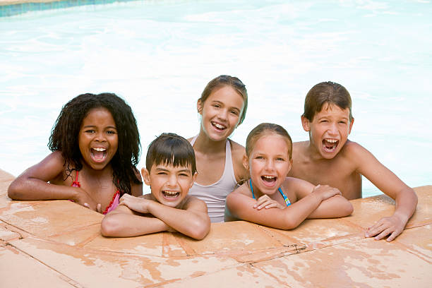 istock Five young friends in swimming pool 92216673