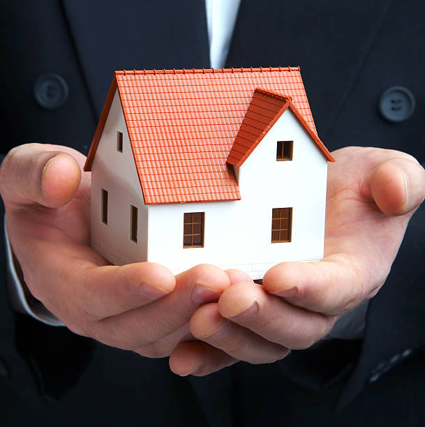 istock The house in a hand 92217163