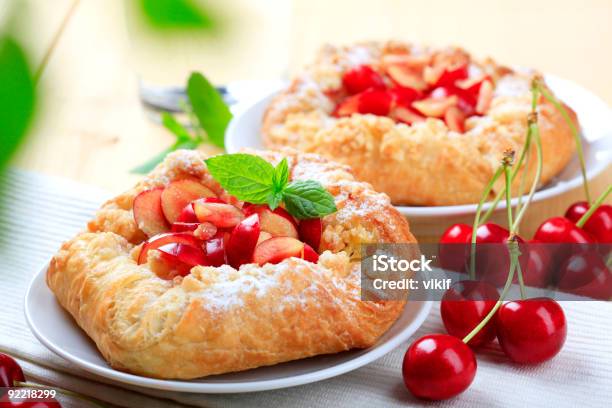 Sweet Pastry With Cherries And Mint Leaf Stock Photo - Download Image Now - Baked, Bing Cherry, Breakfast