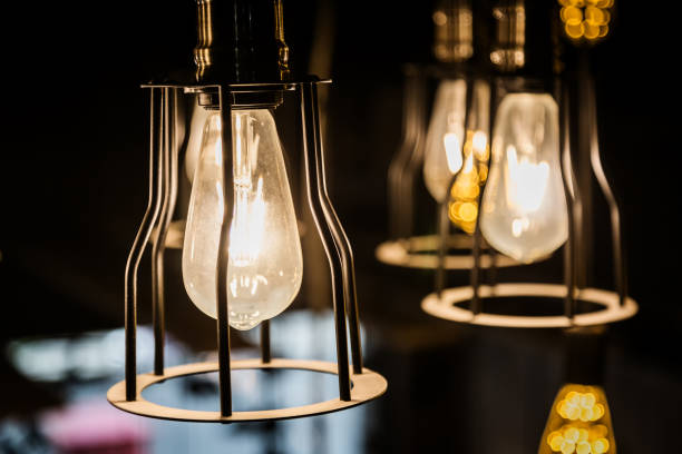 istock old retro vintage light bulb hanginh from ceiling with back background 922186750