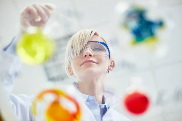 istock Content female scientist working with liquids 922189180
