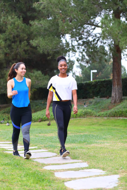 istock Hispanic and African American Ladies walk on Path 922189386