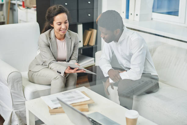 istock Cheerful female manager showing agreement to phantom client 922189550