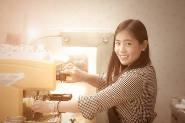 istock Beautiful woman Barista with Coffee Maker 922191776
