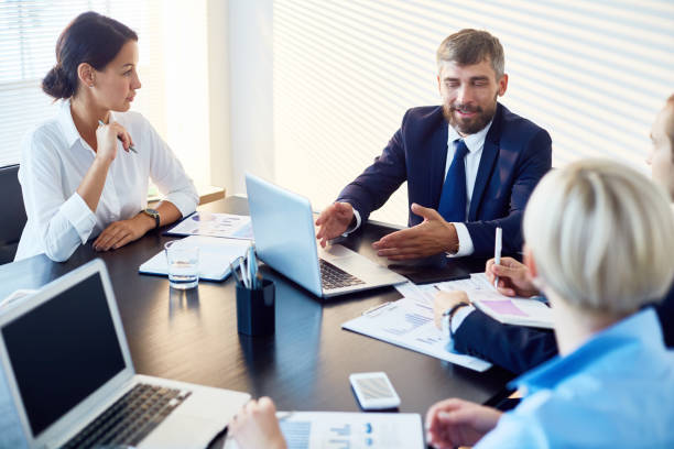 istock Confident businessman presenting idea at meeting 922192394