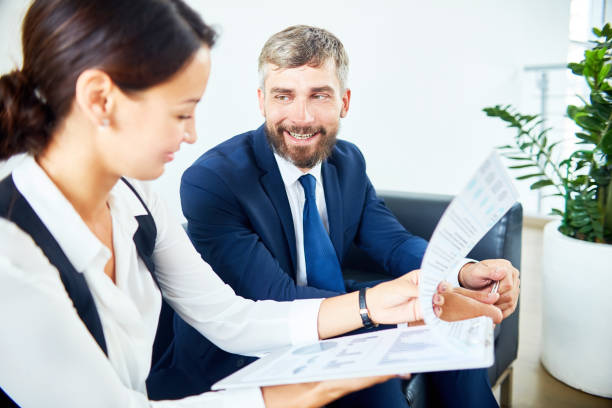 istock Cheerful bearded businessman sharing strategy to assistant 922196670