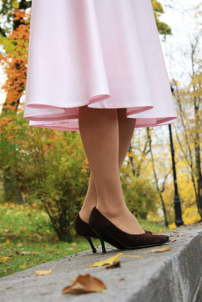 istock beautiful legs in a pink skirt 92220565
