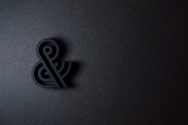 istock black ampersand with parallel lines on black background 922207284
