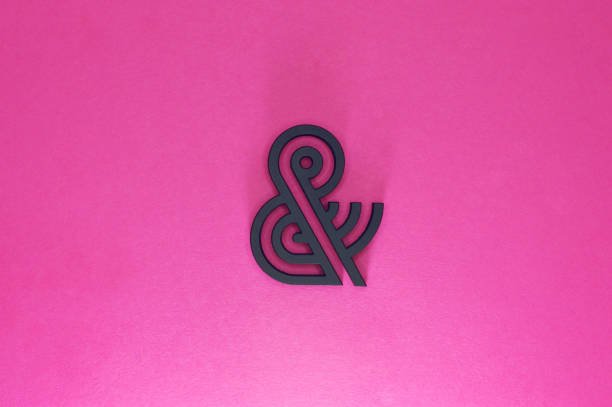 istock black ampersand with parallel lines on pink background 922207294