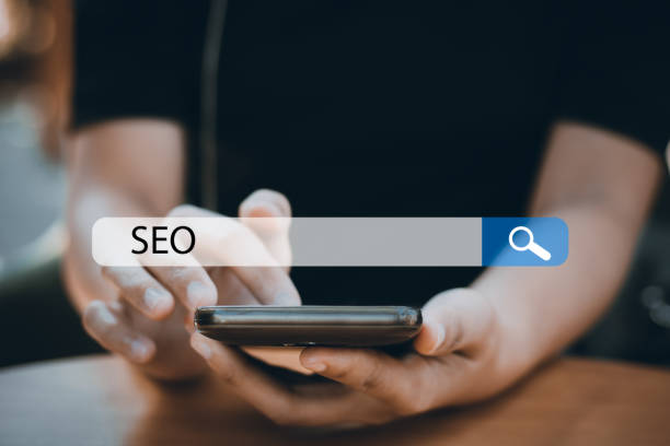 istock Searching Engine Optimizing SEO Browsing Concept, Businessman holding phone for looking information 922210318