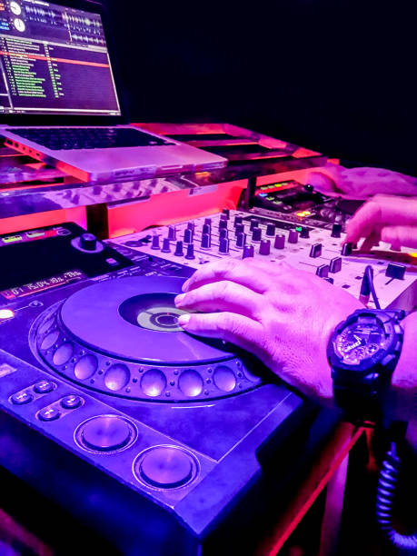 istock DJs are turntablism turntables plate mixer night party pub Motion blur wite light sunset abstract background. 922210944
