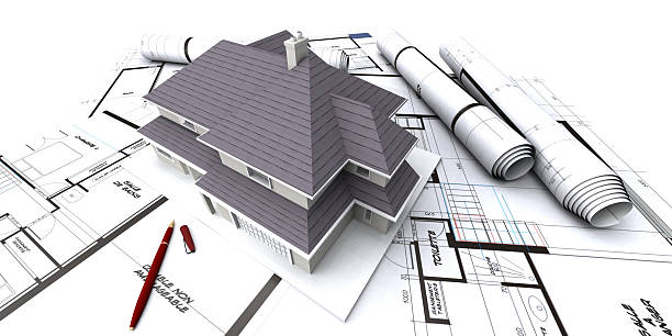 istock house mockup on top of architect's plans / blueprints 92221612