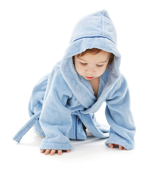 istock baby boy in blue robe 92221748